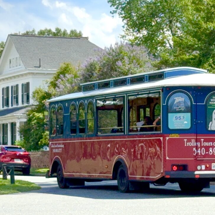 A red trolley bus labeled