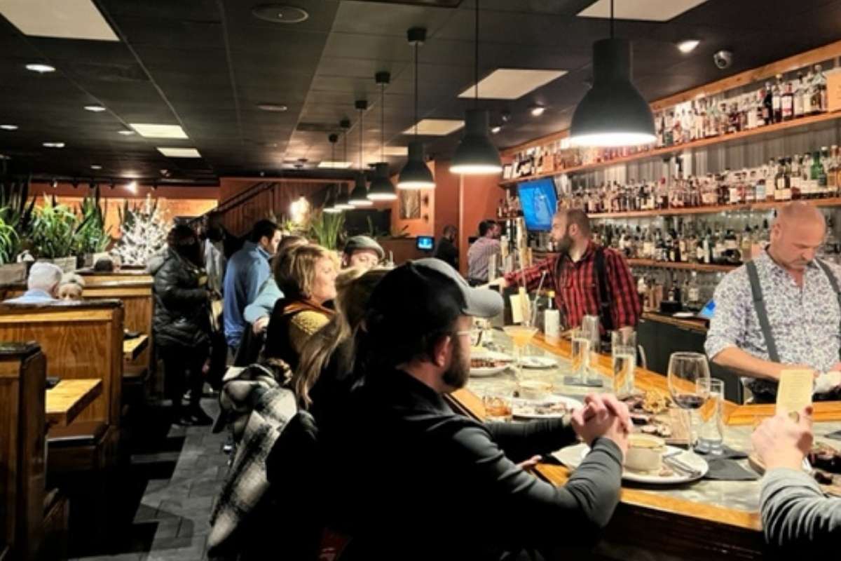 wooden bar at happy hour at fredericksburg steakhouse