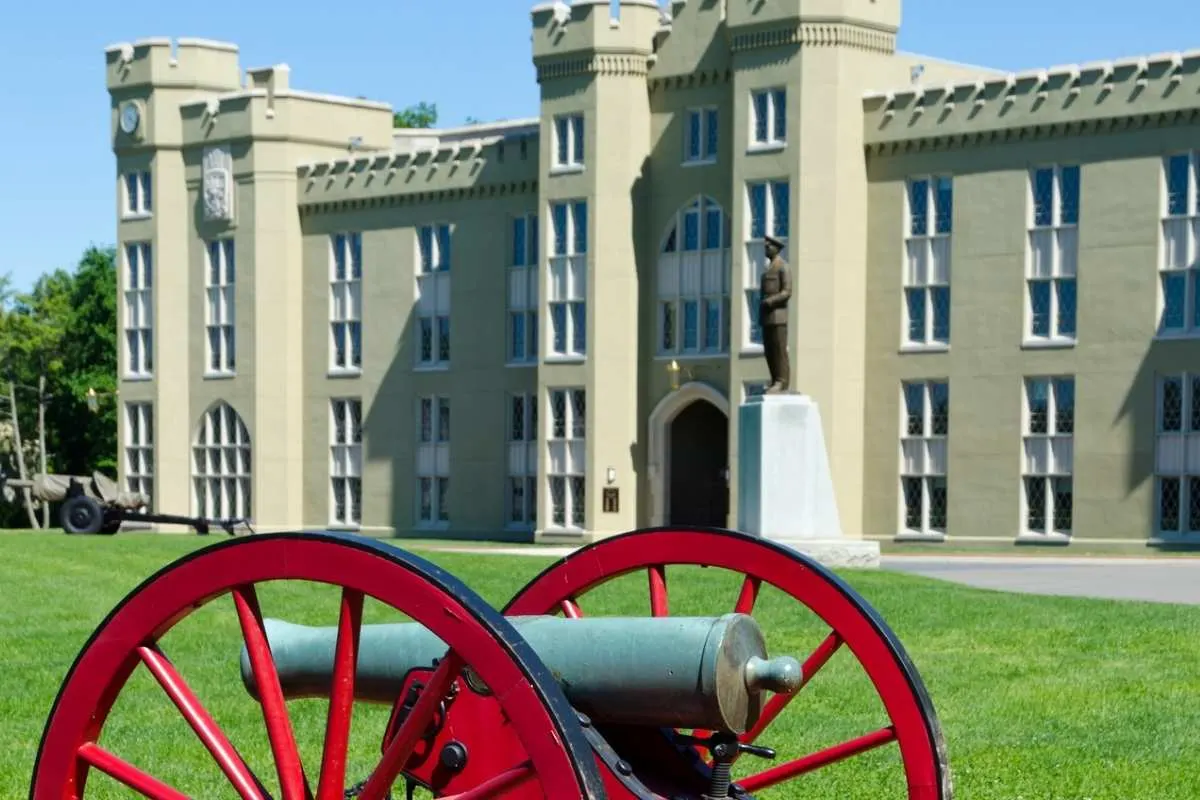large stone building with cannon in front