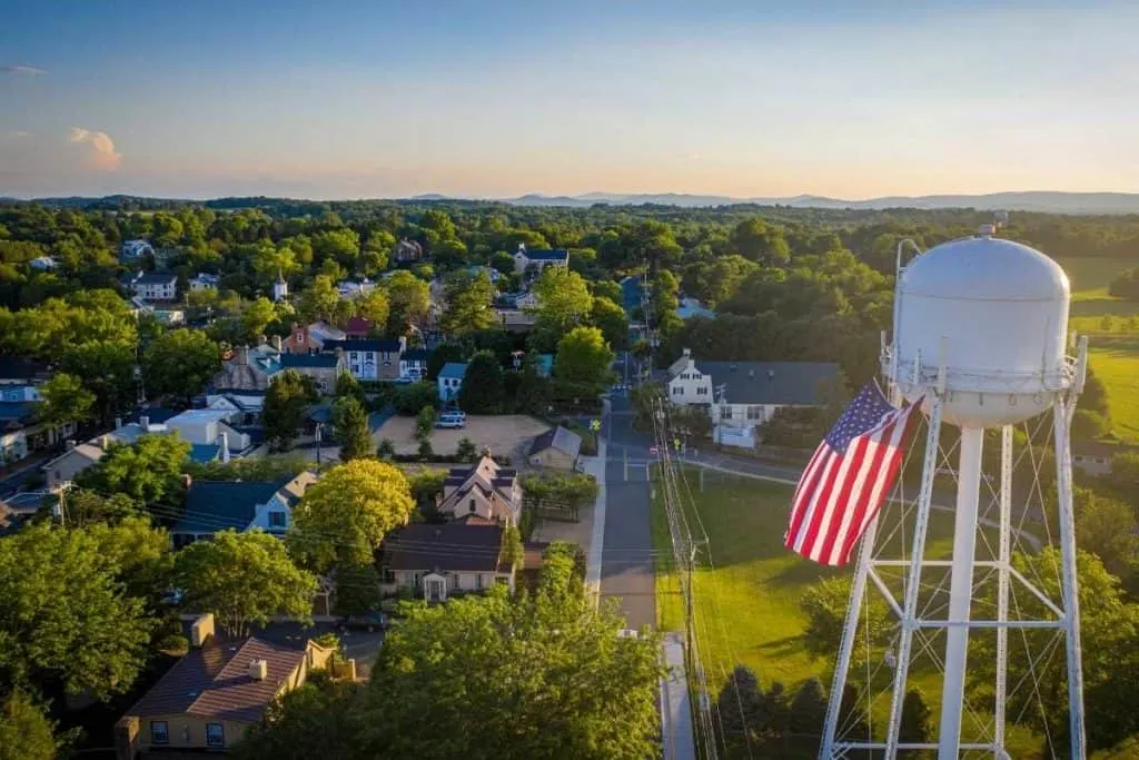 overhead view of small town with water tower