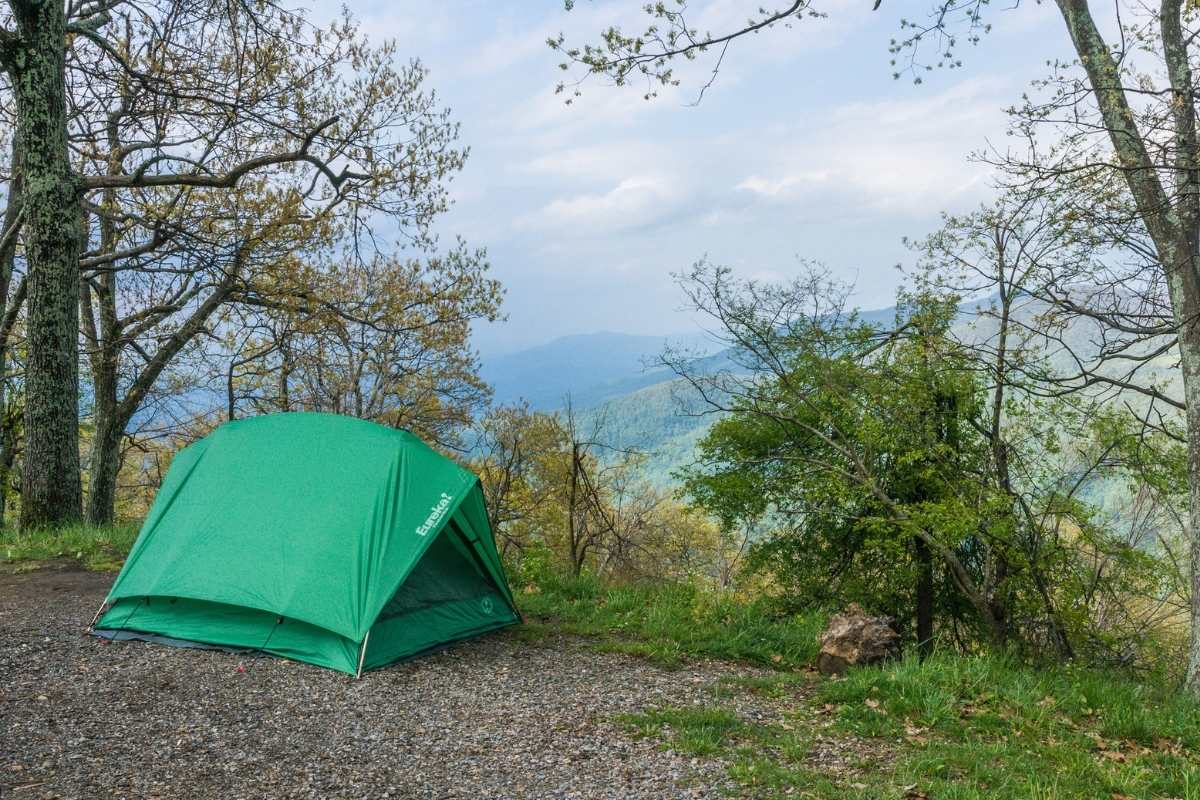 green tent on mountainside