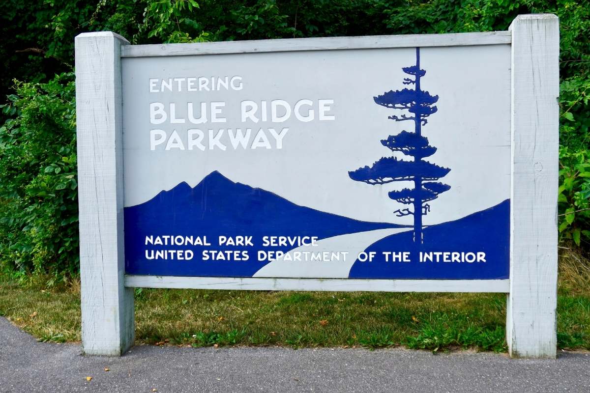 blue and gray sign reading "blue ridge parkway: