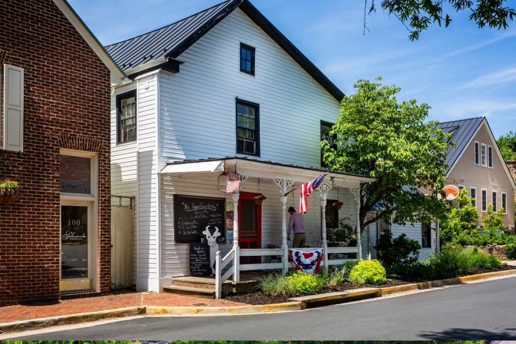 white historic house on town street