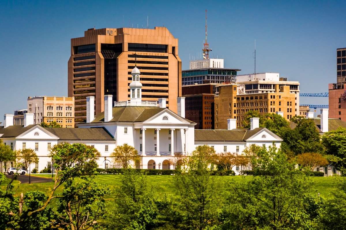 skyline of downtown richmond with white house in front