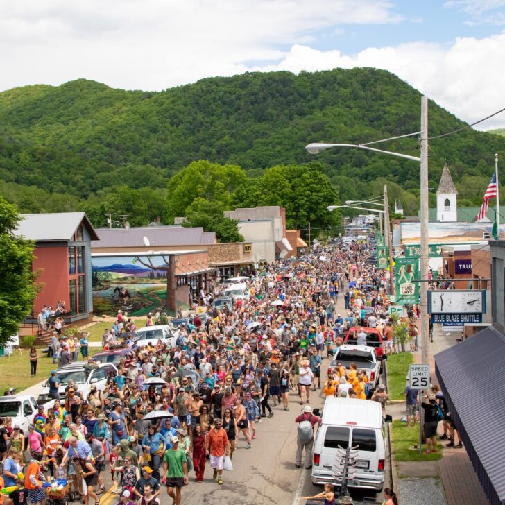 crowds of hikers walk down the Main Street of Damascus, VA