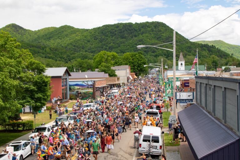 crowds of hikers walk down the Main Street of Damascus, VA