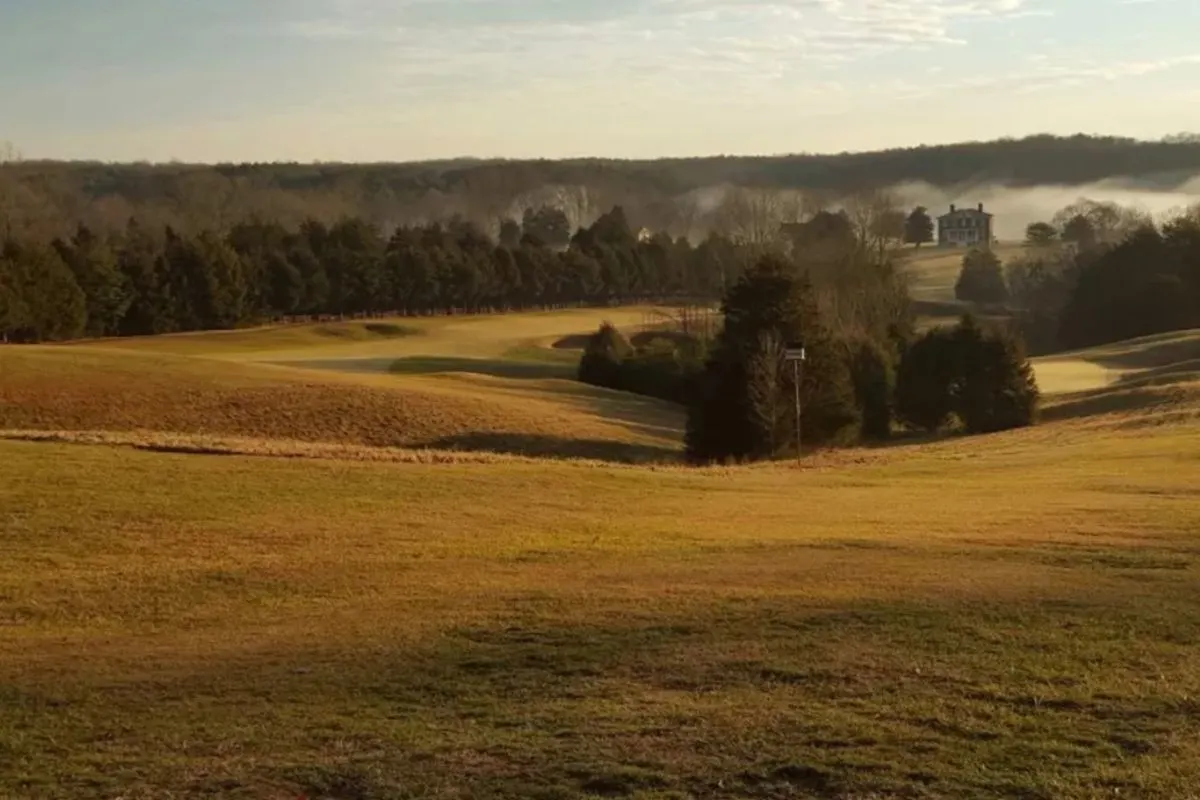 fall mist over golf course