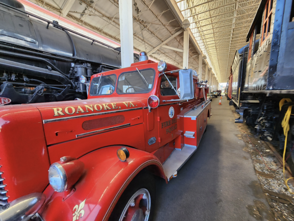 VA Museum of Transportation Exterior Rail Collection with vintage red fire truck and steam locomotives