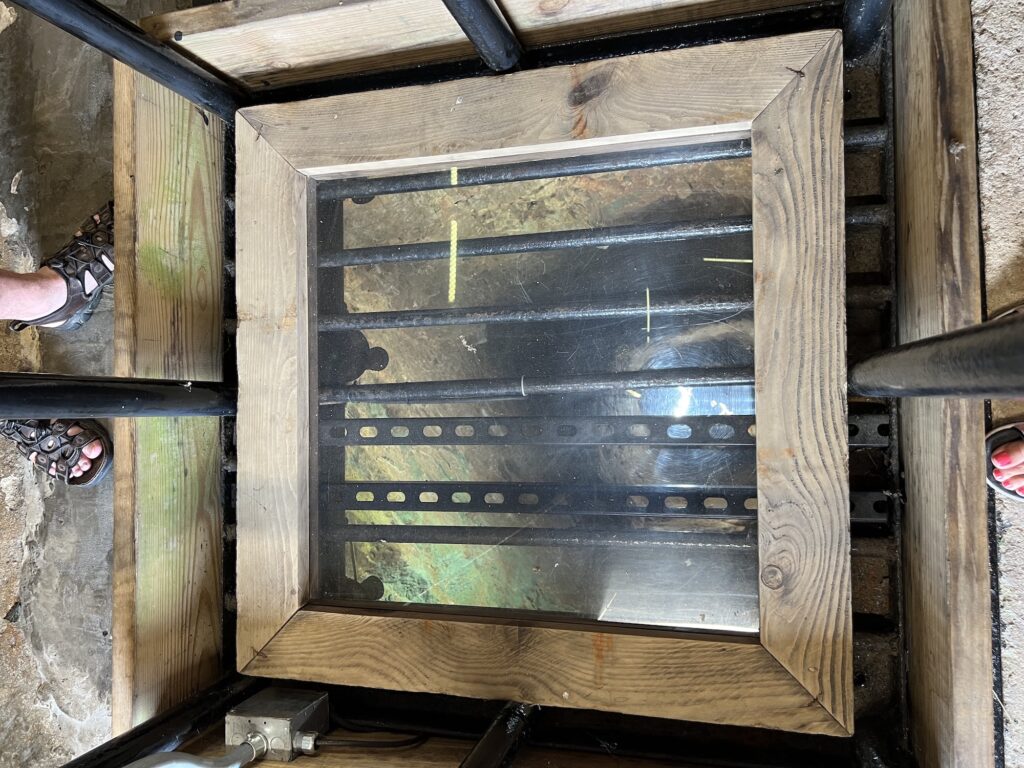 A mirror contained within a wooden frame at Shot Tower State Park.