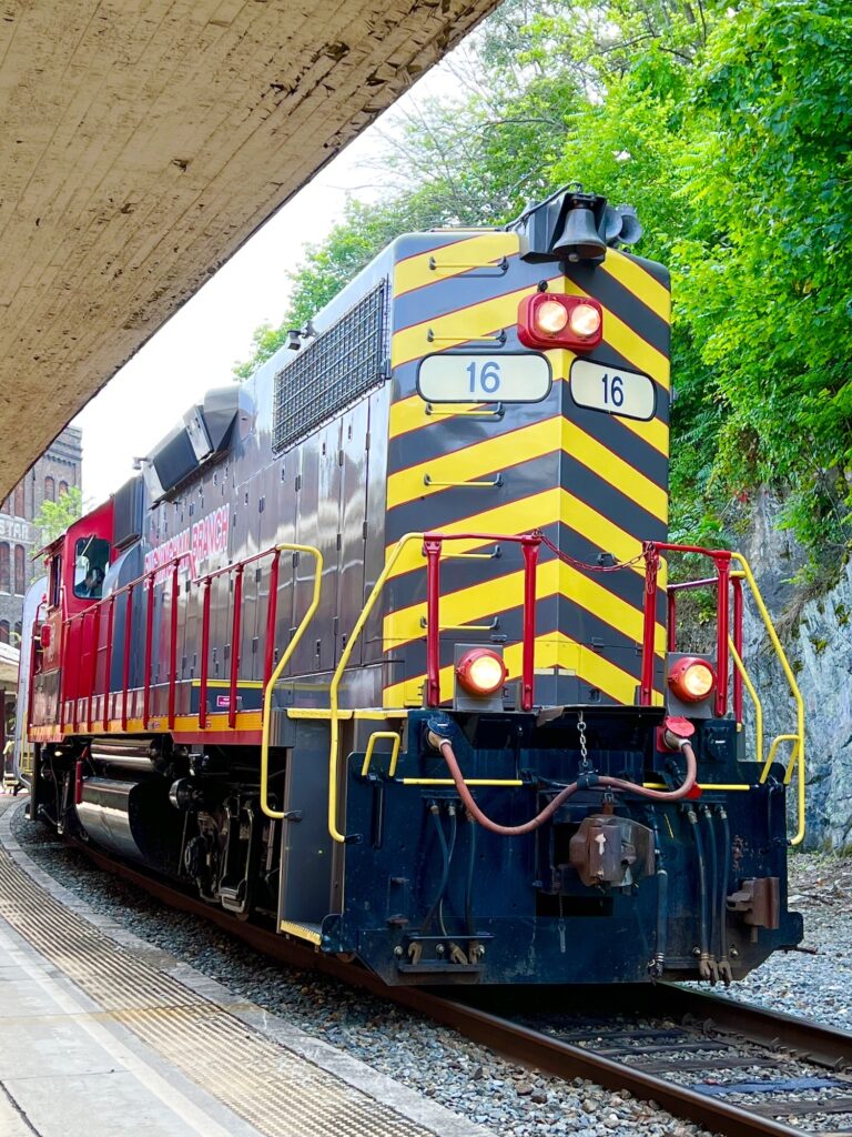 A free red and black train on a train track in Staunton.