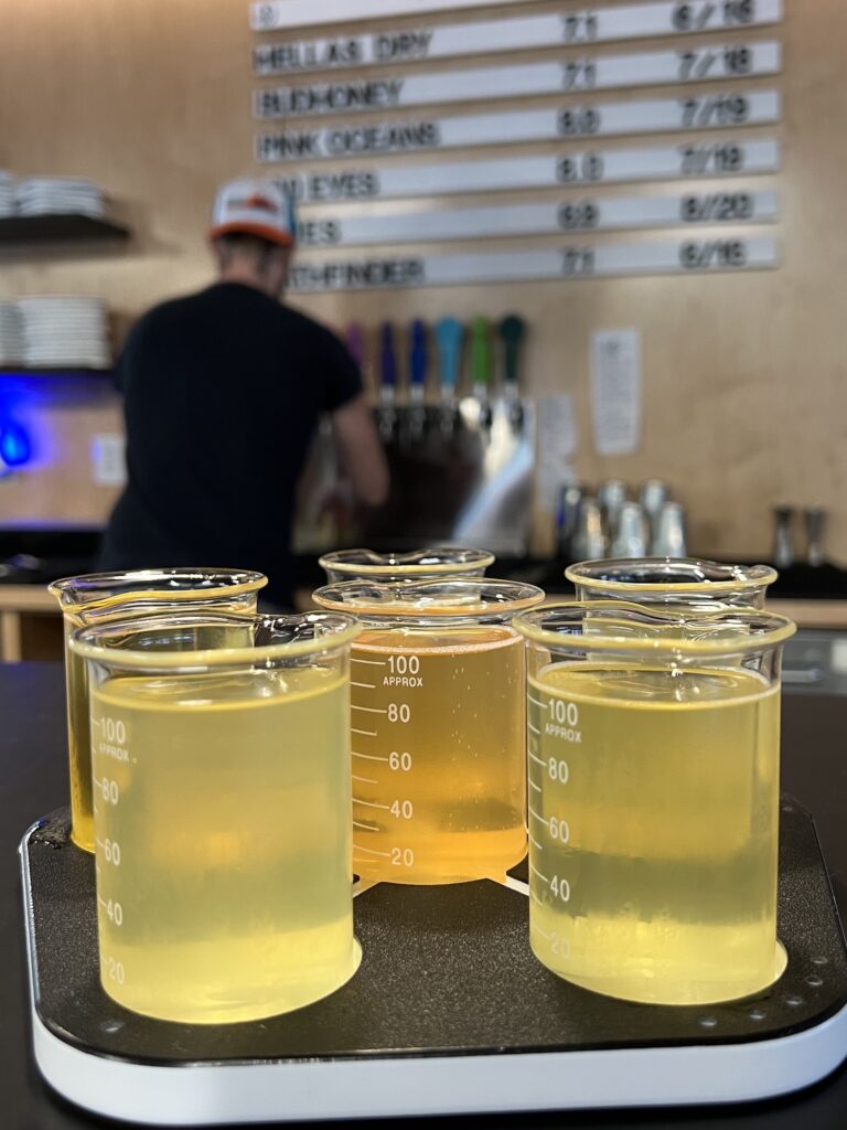 A bartender expertly pours a yellow liquid into a glass at one of Staunton's hotspots.