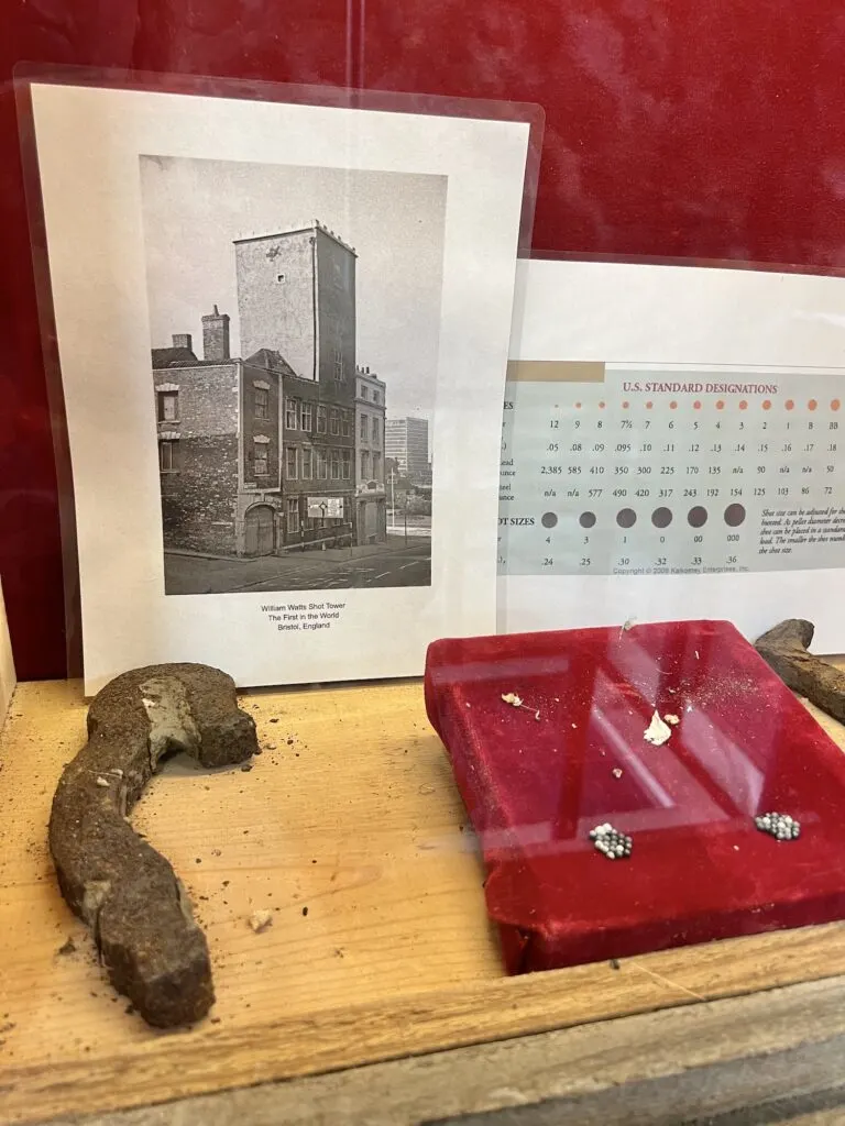 A shot tower display case at the state park showcases various items.